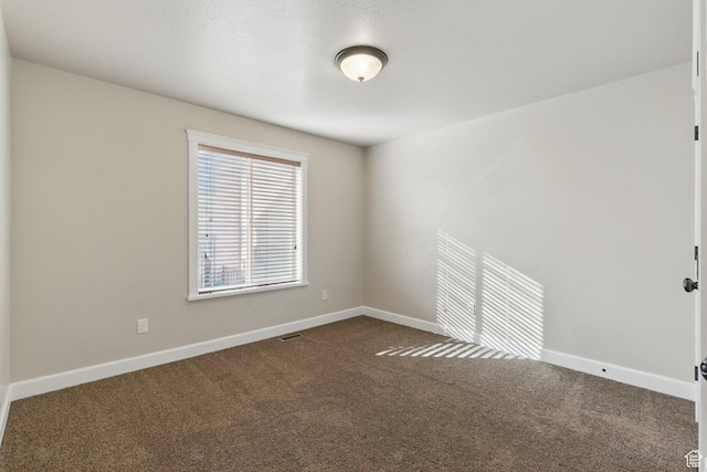 1247 N Baycrest Dr, Saratoga Springs, UT 84045 - spare room featuring dark carpet and baseboards