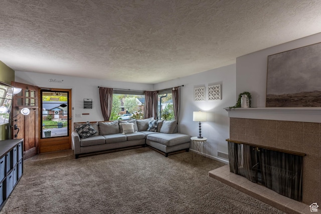 1431 Capitol St, Ogden, UT 84401 - living room with visible vents, baseboards, a fireplace, a textured ceiling, and carpet flooring