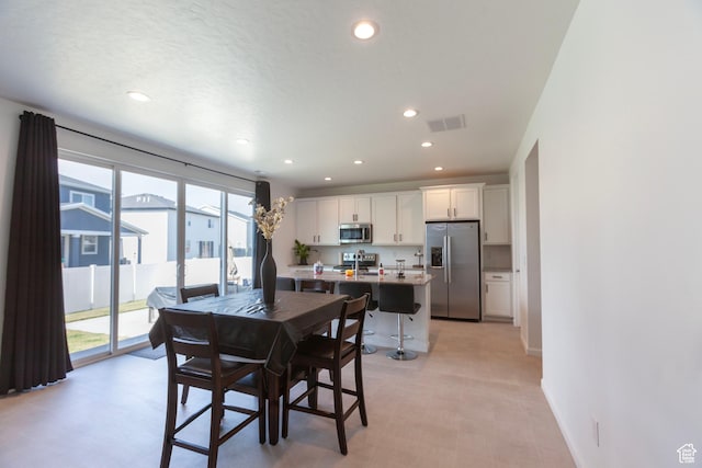 1719 N Pintail Dr Unit 60, Salem, UT 84653 - dining space with baseboards, visible vents, and recessed lighting