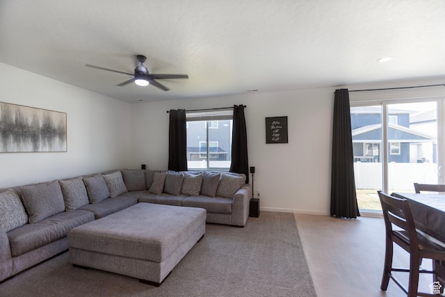 1719 N Pintail Dr Unit 60, Salem, UT 84653 - living area featuring ceiling fan, a wealth of natural light, baseboards, and light carpet