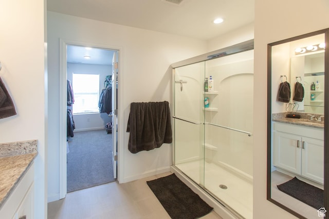 1719 N Pintail Dr Unit 60, Salem, UT 84653 - bathroom with visible vents, baseboards, vanity, and a stall shower