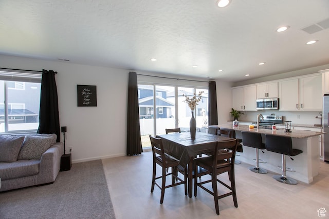 1719 N Pintail Dr Unit 60, Salem, UT 84653 - dining space with baseboards, visible vents, and recessed lighting