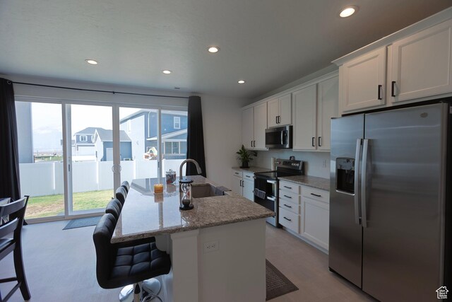 1719 N Pintail Dr Unit 60, Salem, UT 84653 - kitchen with white cabinets, a sink, recessed lighting, and appliances with stainless steel finishes