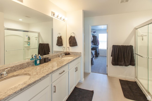 1719 N Pintail Dr Unit 60, Salem, UT 84653 - full bath with baseboards, double vanity, a stall shower, and a sink