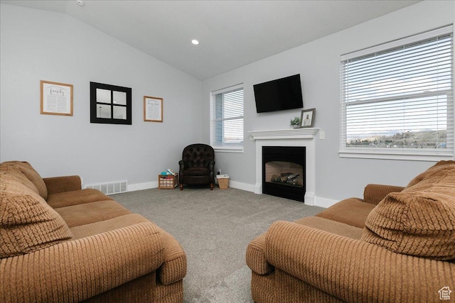 2763 E Read Ln, Preston, ID 83263 - living room featuring carpet flooring, vaulted ceiling, visible vents, baseboards, and a fireplace