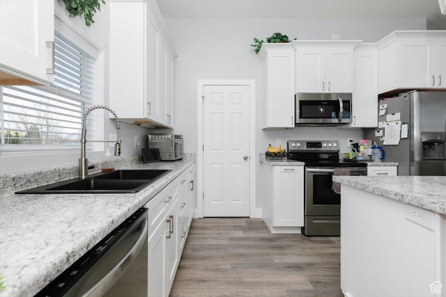 2763 E Read Ln, Preston, ID 83263 - kitchen with white cabinetry, stainless steel appliances, and a sink