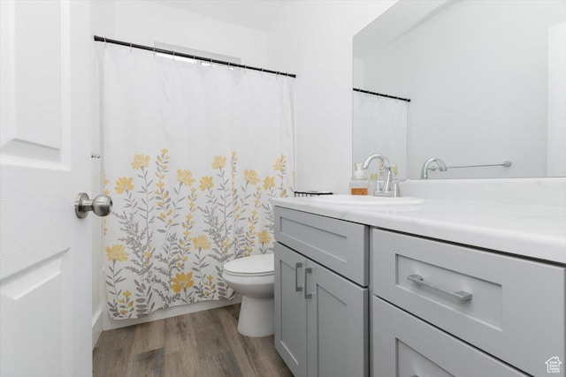 2763 E Read Ln, Preston, ID 83263 - full bath featuring wood finished floors, curtained shower, vanity, and toilet