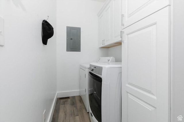 2763 E Read Ln, Preston, ID 83263 - clothes washing area with wood finished floors, electric panel, washer and dryer, cabinet space, and baseboards