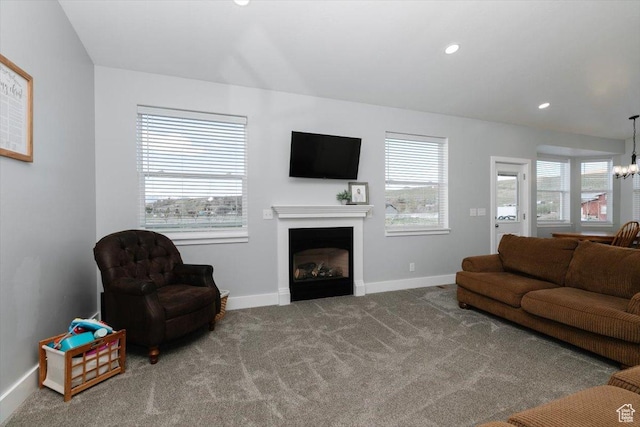 2763 E Read Ln, Preston, ID 83263 - carpeted living area featuring a fireplace, a chandelier, baseboards, and recessed lighting