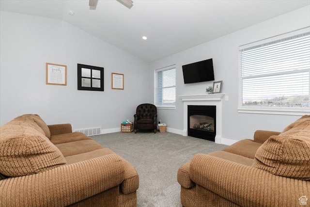 2763 E Read Ln, Preston, ID 83263 - carpeted living room with visible vents, vaulted ceiling, baseboards, and a fireplace