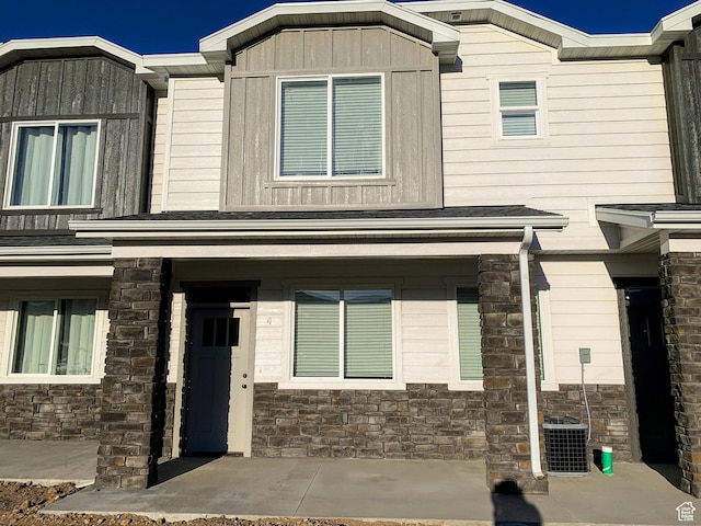 150 W Seasons Ln Unit 4, Garden City, UT 84028 - view of front of house with stone siding and cooling unit