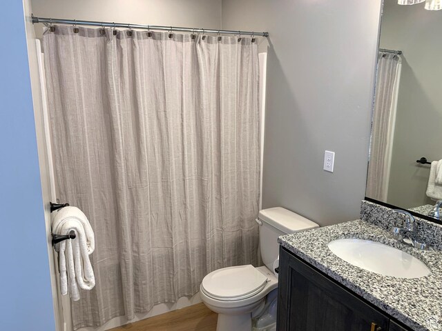 150 W Seasons Ln Unit 4, Garden City, UT 84028 - bathroom with toilet, vanity, and a shower with shower curtain