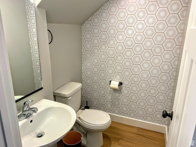 150 W Seasons Ln Unit 4, Garden City, UT 84028 - half bath with toilet, wood finished floors, a sink, and baseboards
