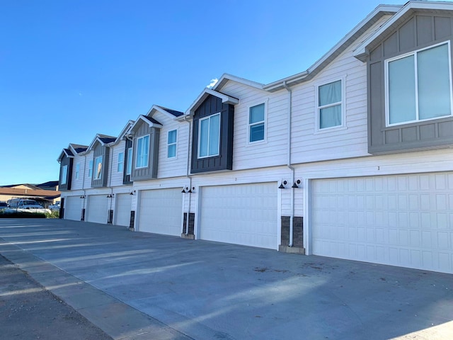 150 W Seasons Ln Unit 4, Garden City, UT 84028 - exterior space with board and batten siding and an attached garage