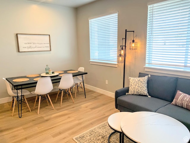 150 W Seasons Ln Unit 4, Garden City, UT 84028 - living room featuring light wood-type flooring, baseboards, and plenty of natural light