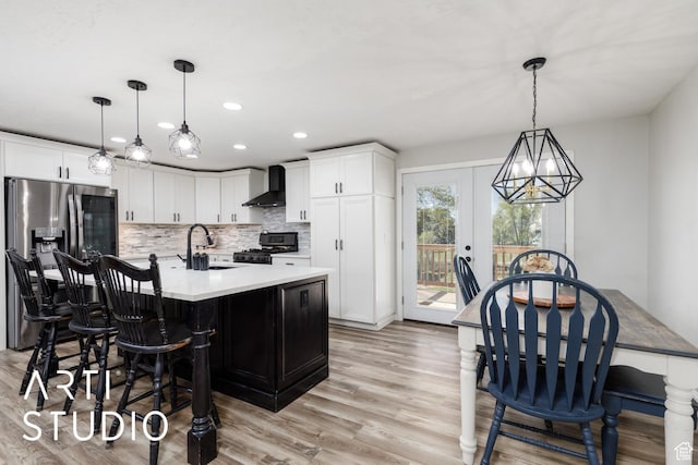 4351 W 1400 N, Plain City, UT 84404 - kitchen featuring a sink, wall chimney range hood, recessed lighting, stove, and stainless steel fridge with ice dispenser