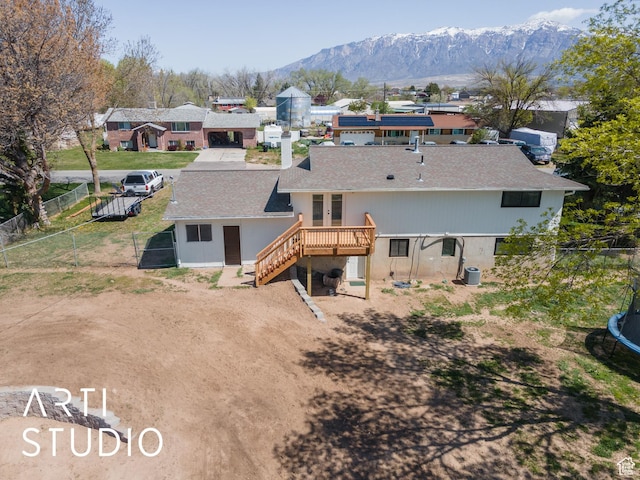 4351 W 1400 N, Plain City, UT 84404 - rear view of property featuring stairway, a deck with mountain view, a fenced backyard, french doors, and roof with shingles