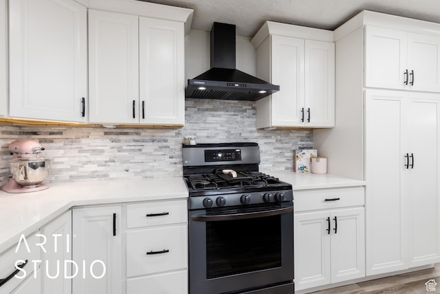 4351 W 1400 N, Plain City, UT 84404 - kitchen with stainless steel range with gas cooktop, wall chimney exhaust hood, white cabinets, and light countertops