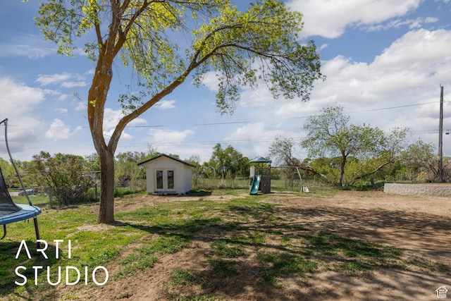 4351 W 1400 N, Plain City, UT 84404 - view of yard featuring french doors, an outbuilding, a playground, and a trampoline