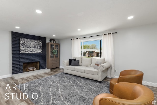 4351 W 1400 N, Plain City, UT 84404 - living area featuring a fireplace, baseboards, wood finished floors, and recessed lighting
