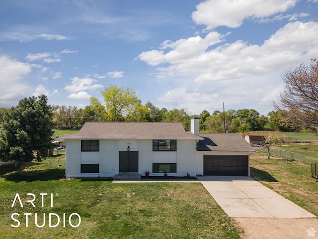 4351 W 1400 N, Plain City, UT 84404 - split foyer home with a garage, driveway, a front yard, and fence