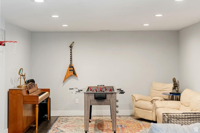 playroom featuring wood finished floors, baseboards, and recessed lighting