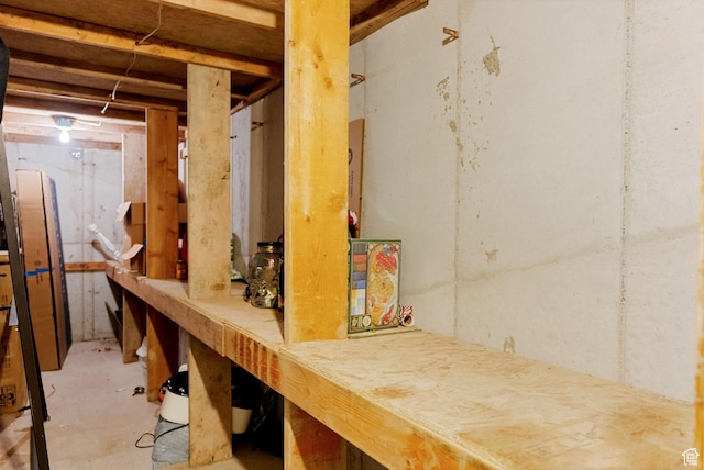 miscellaneous room featuring unfinished concrete flooring