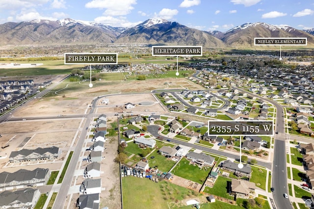 drone / aerial view featuring a mountain view and a residential view