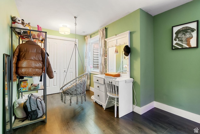 interior space with baseboards and dark wood-style floors