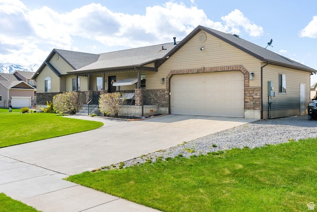 view of front facade featuring driveway, stone siding, a porch, a garage, and a front yard