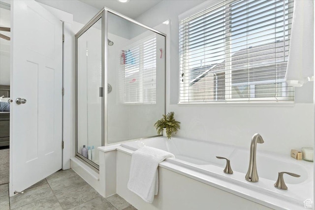 4941 W Chrome Rd, Herriman, UT 84096 - full bath with a bath, a stall shower, tile patterned flooring, and plenty of natural light