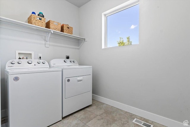 4941 W Chrome Rd, Herriman, UT 84096 - laundry area featuring washer and clothes dryer, visible vents, baseboards, and laundry area