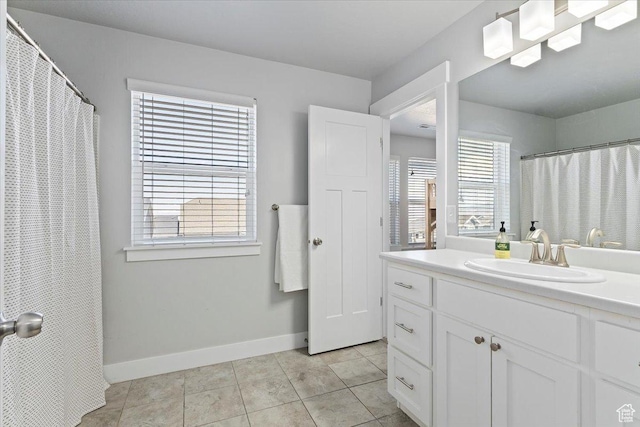 4941 W Chrome Rd, Herriman, UT 84096 - bathroom with baseboards, vanity, and tile patterned floors