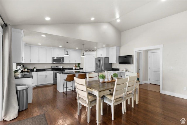 dining space with recessed lighting, high vaulted ceiling, baseboards, and dark wood-style floors