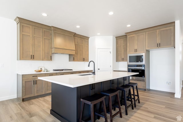 3080 N 2875 W Unit 25, Plain City, UT 84404 - kitchen with appliances with stainless steel finishes, custom exhaust hood, a sink, light wood-type flooring, and recessed lighting