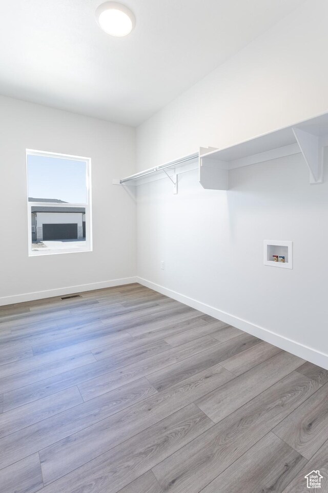 3080 N 2875 W Unit 25, Plain City, UT 84404 - walk in closet featuring wood finished floors and visible vents
