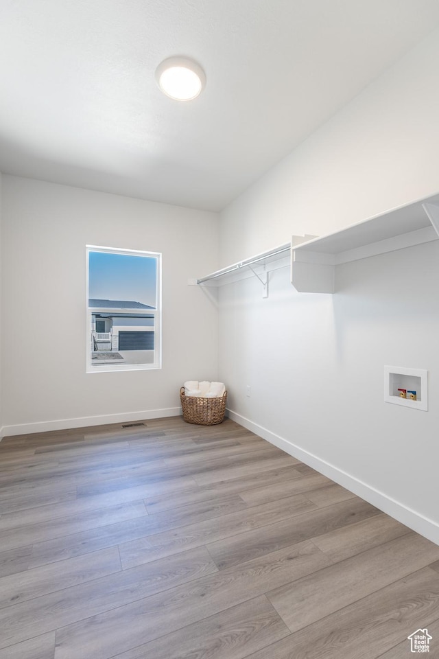 3080 N 2875 W Unit 25, Plain City, UT 84404 - walk in closet featuring wood finished floors