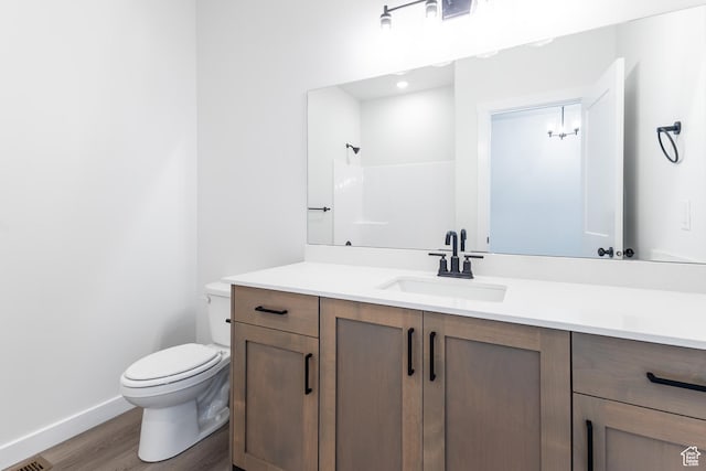 3080 N 2875 W Unit 25, Plain City, UT 84404 - full bathroom featuring toilet, baseboards, wood finished floors, a shower, and vanity