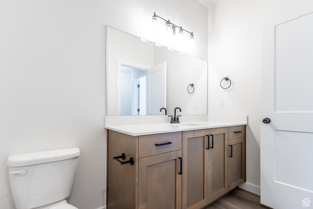3080 N 2875 W Unit 25, Plain City, UT 84404 - half bathroom featuring vanity, toilet, wood finished floors, and baseboards