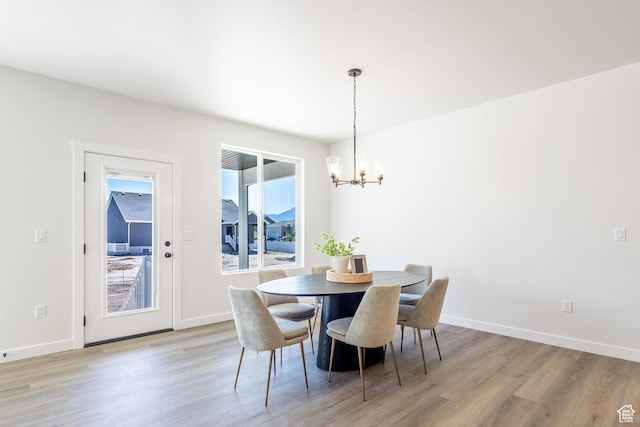 3080 N 2875 W Unit 25, Plain City, UT 84404 - dining space with a chandelier, light wood-style floors, and baseboards