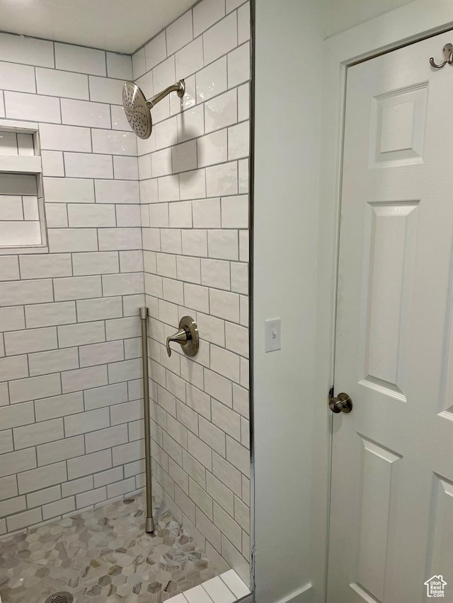 bathroom with a shower stall