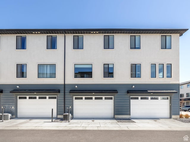 452 S Wood Stream Rd, American Fork, UT 84003 - townhome / multi-family property with stucco siding, cooling unit, and a garage