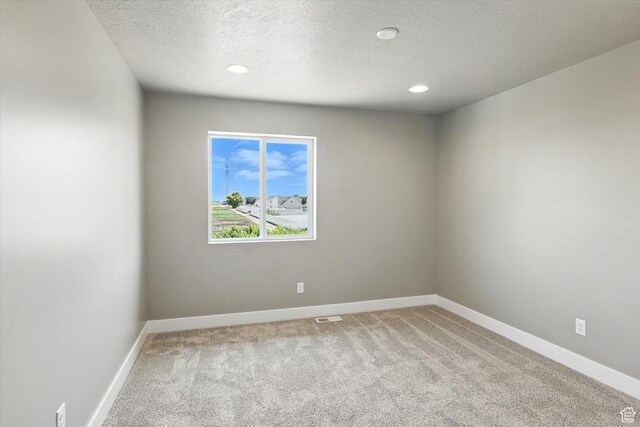1273 S 240 W Lot 9, Tremonton, UT 84337 - spare room with light carpet, a textured ceiling, and recessed lighting
