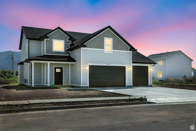 1273 S 240 W Lot 9, Tremonton, UT 84337 - view of front of house with driveway, a garage, and roof with shingles