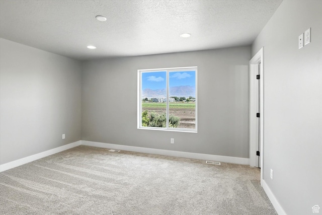 1273 S 240 W Lot 9, Tremonton, UT 84337 - empty room with light carpet, a textured ceiling, and recessed lighting