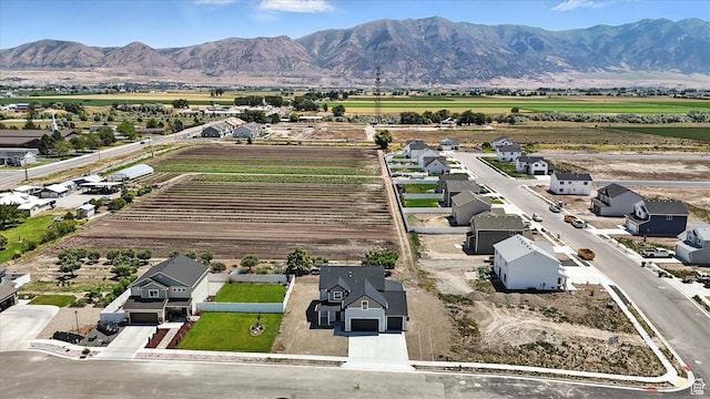 1273 S 240 W Lot 9, Tremonton, UT 84337 - aerial view of sparsely populated area featuring a mountain backdrop and extensive farmland