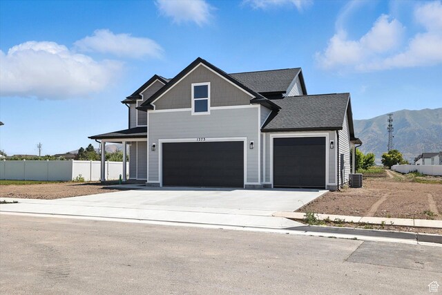 1273 S 240 W Lot 9, Tremonton, UT 84337 - view of front facade with a mountain view, driveway, an attached garage, and a shingled roof