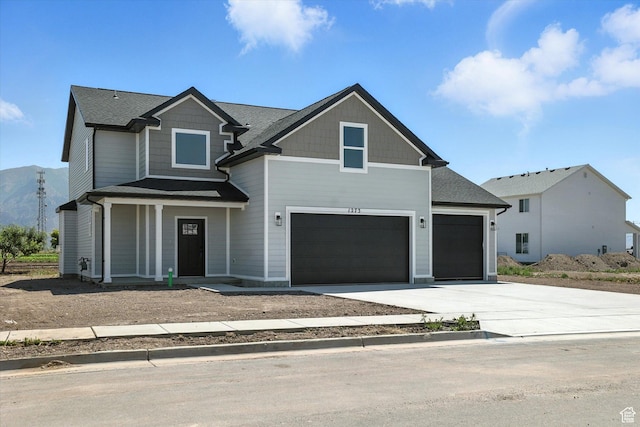 1273 S 240 W Lot 9, Tremonton, UT 84337 - craftsman-style home with driveway, a porch, and a garage
