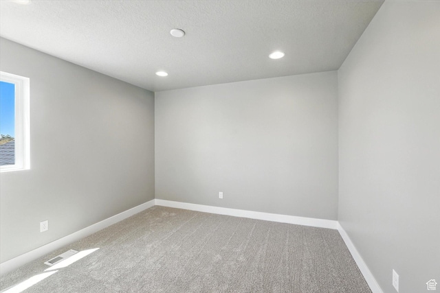 1273 S 240 W Lot 9, Tremonton, UT 84337 - empty room with carpet, recessed lighting, and a textured ceiling