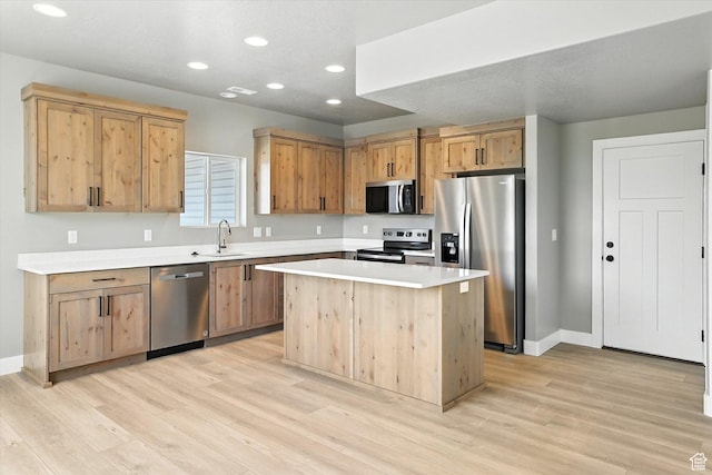 1273 S 240 W Lot 9, Tremonton, UT 84337 - kitchen with appliances with stainless steel finishes, light wood-style flooring, recessed lighting, light countertops, and a kitchen island